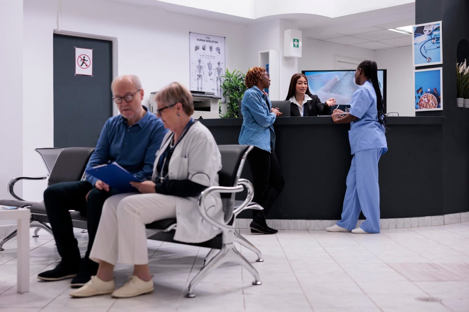 1732084966 patient nurse sitting reception desk talking female receptionist about disease diagnosis healthcare 1536x1024